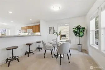 Dining area + kitchen (staged)
