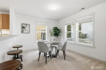 Dining area + kitchen (staged)