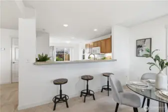 Dining area + kitchen (staged)
