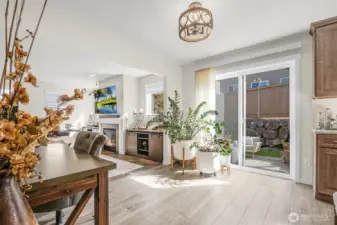 Living room, backyard slider and kitchen.