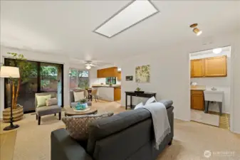 Garage entry through laundry room on right. Kitchen and backyard access.