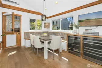 a dutch door, built-in beverage center, benches with storage - everything is functional and charming.