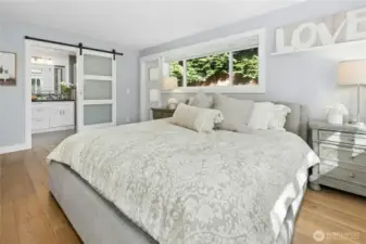 Primary Bedroom with en-suite bathroom and private access to the hot tub and deck.