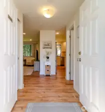 Gorgeous LVP flooring, utility to the right of entry and coat closet to the left.