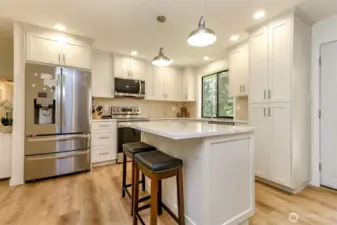 Island with storage and seating.