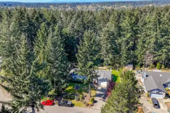 Aerial view gives another perspective of behind the house.