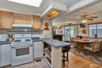 Kitchen open to dining area and living room.