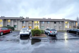 Front of building. Unit is on second floor, with only 2 steps down at the sidewalk to access the unit.