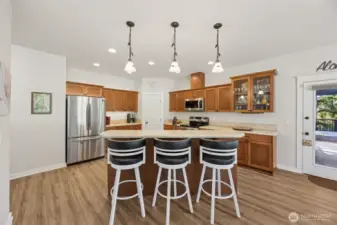 Beautiful maple kitchen with newer appliances, eating bar, and a walk-in pantry.