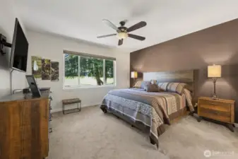 Primary bedroom overlooks the golf course and includes a 5-piece bath and walk-in closet.