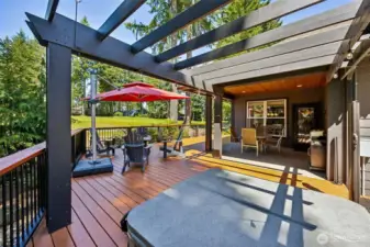 This is a large outdoor space for entertaining and includes a hot tub!