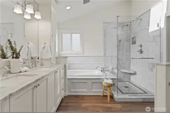 Marble slab on the double vanity ad tub deck.