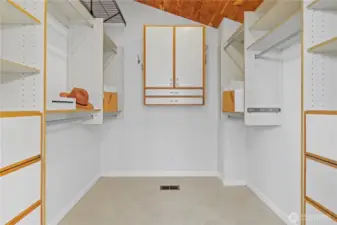 Big primary walk-in closet with a vaulted ceiling for lots of extra room for storage.