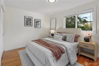 3rd bedroom on the main level. This is the largest and has a cute built-in bookshelf beside the closet.