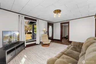 View of the front door and front bedroom