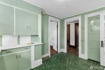 Left door is to the dining room, middle hallway to the bathroom, right door is the pantry/furnace location.