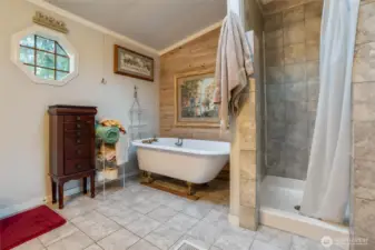 Cool ball and claw tub and tiled shower.