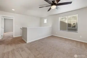 Upper level features a versatile flex room and bedrooms