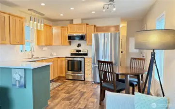 The kitchen has been updated with quartz counters, new lighting and microwave.