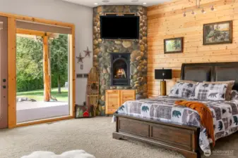 Slider to back patio and fireplace in primary bedroom.
