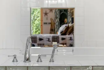 Soaking tub has option to open a viewing window for celestial views while taking a relaxing bath.