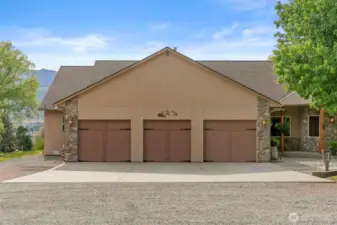 3 car attached garage with additional storage room.