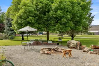 With multiple firepits, horseshoes, room for a par four hole of golf, sledding hills, underground sprinklers for the two irrigation pumps, etc.  This property is simply an amazing oasis.