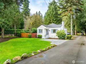 Expansive Front Yard with additonal parking space in front if desired.  Detached Garage and additional parking behind house.