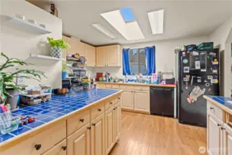 Kitchen w/Tiled Counters and Skylight for plenty of Natural Light!
