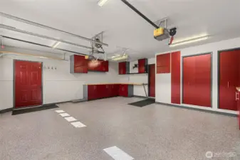 Upgraded 2 car garage with epoxy floors and man door to exterior