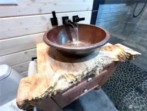 Copper sink on live curly maple countertop