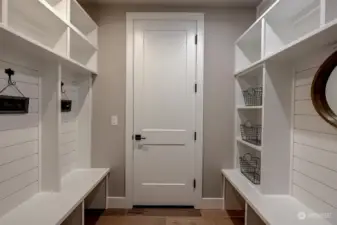 Mudroom entry from the garage with built-in storage and benches.