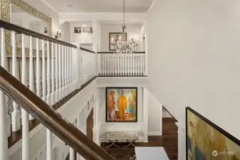 The striking staircase leads the way to the upper level.