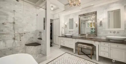 Spa bathroom allying elegance and coziness. Two sets of walk-in closets (his and hers).