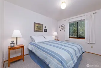 Main floor primary bedroom with attached bath.
