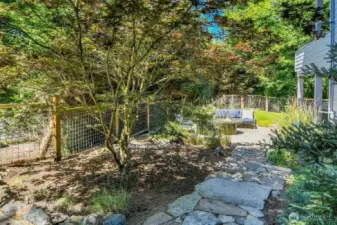 Stone walk way to fire pit in private back yard