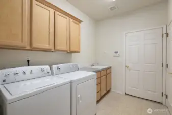 Laundry with sink and storage
