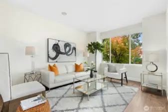 Formal living with upgraded hardwood floors throughout the main level