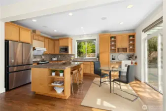 Fully functional kitchen with east-facing window and a gas cooking range.