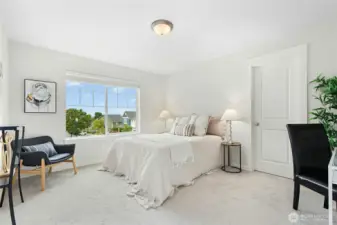 Large bedroom with a walk-in closet.  View of Mt. Baker on clear days.