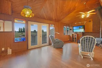 Living room with french doors and MT views