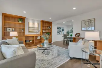 Inviting living room off the entry showcases custom wood built-ins.