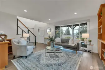 Wide picture window invites in warm, natural light.