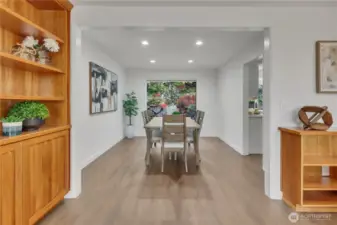 Dining room off kitchen with views of the landscaped backyard.