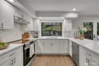 Large garden window overlooks the backyard.
