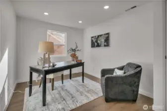 Bedroom off family room, currently staged as an office.