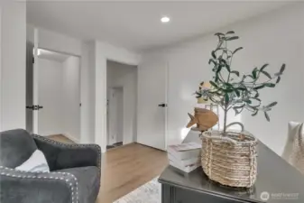 Two closets, one walk-in and another with shelving.