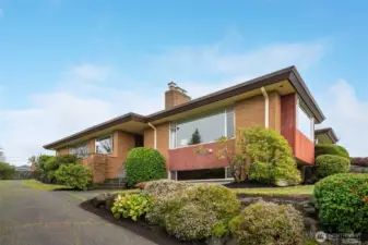 Brick exterior and established landscaping welcome you at front door.