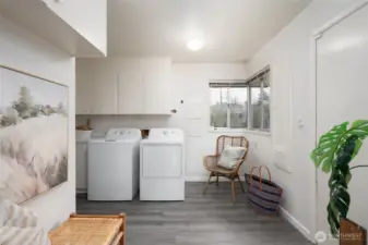 Off the kitchen is a utility room with exterior entrance to yard and laundry.