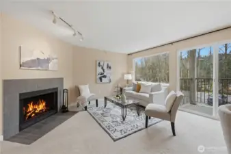 Living room with wood burning fireplace.